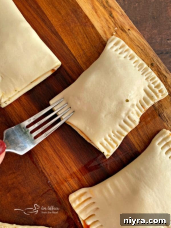 Dorothy's Pizza Pockets Prep - Sealing with a fork.