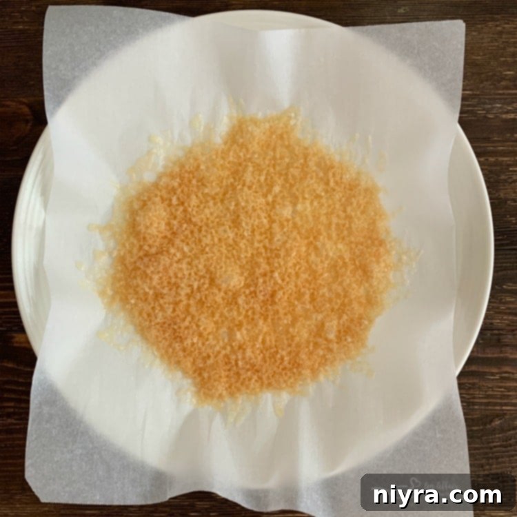 Melted and Bubbling Parmesan Cheese on Parchment Paper