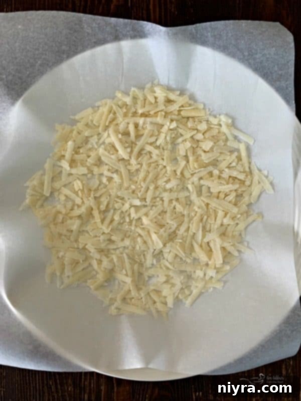 Spreading Grated Parmesan Cheese on Parchment Paper