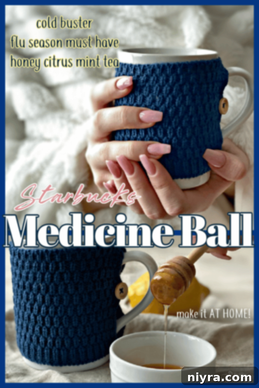hands holding Starbucks copycat medicine ball tea in a mug