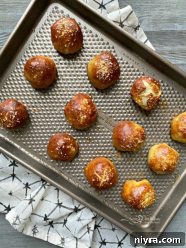 Sausage Pretzel Bombs with Tangy Cheese Dip 15 Baked Sausage Pretzel Bombs on a cookie sheet