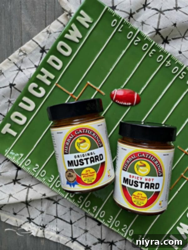 Sausage Pretzel Bombs with Tangy Cheese Dip 3 Herbal Gatherings Mustard bottle with Super Bowl themed decorations