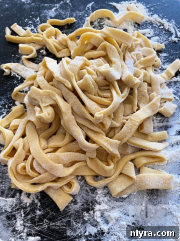 Rolled out homemade egg noodle dough before cutting
