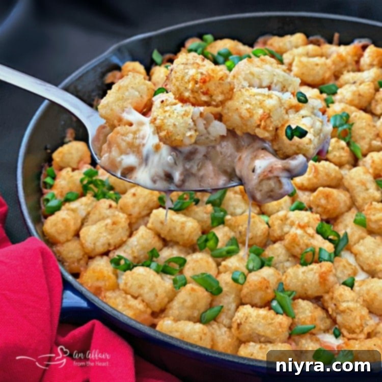 Spicy Tater Tot Casserole with Sausage & Mushrooms spoonful
