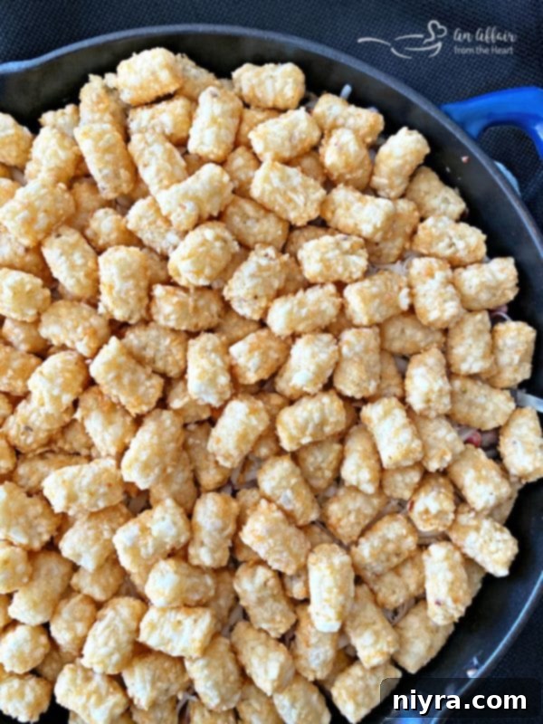 Spicy Tater Tot Casserole with Sausage & Mushrooms prep with tots