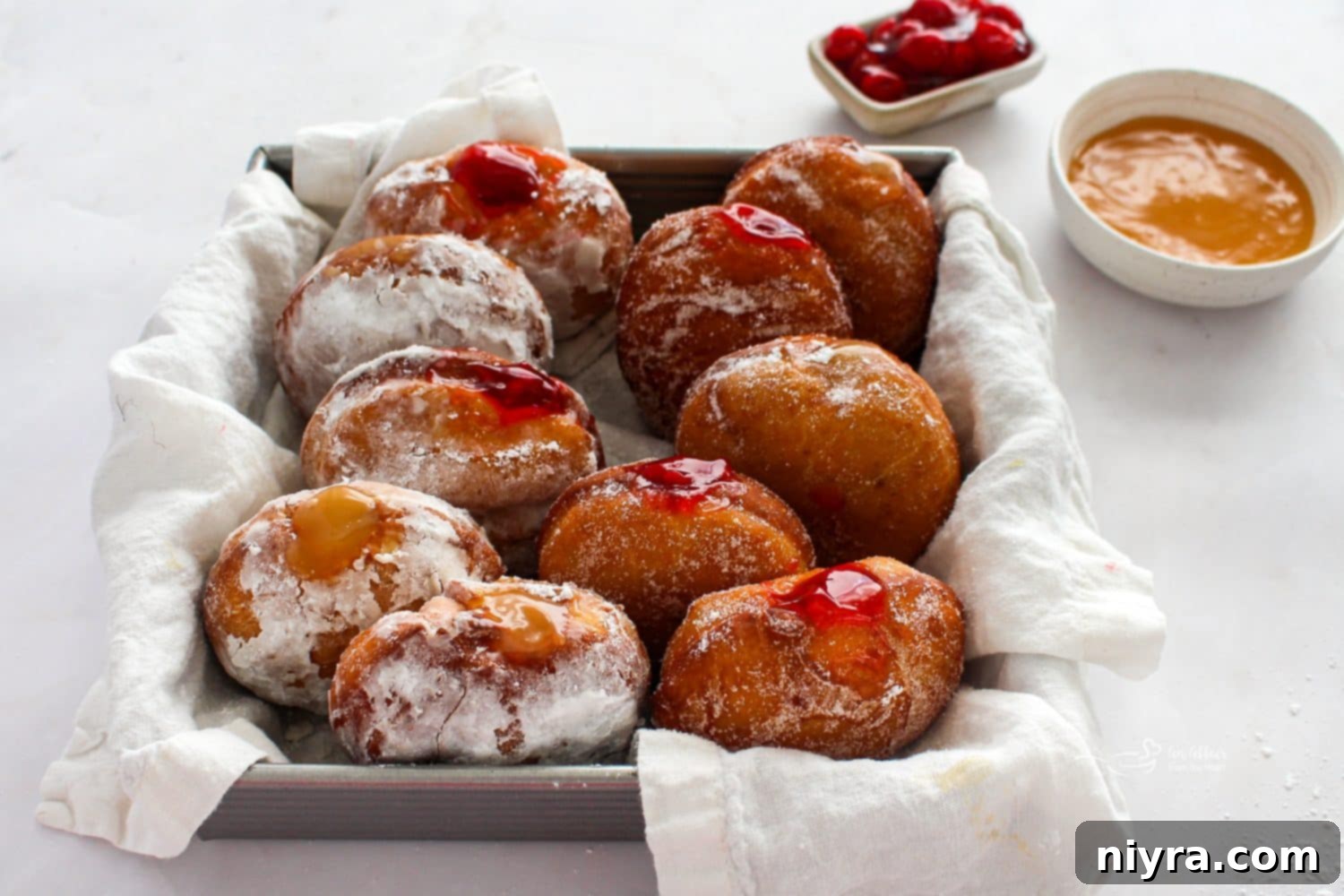 Pączki: The Ultimate Polish Donuts Video 5 Freshly piped jam filling a warm Paczek, illustrating the generous filling of these Polish treats.