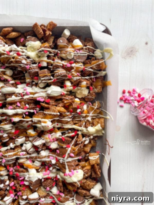 Sea salt being sprinkled over the wet chocolate and caramel drizzles