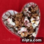 overhead of Better Than Sex Chex Mix in a heart shaped bowl