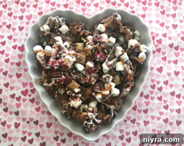 Overhead shot of a large batch of Better Than Sex Chex Mix on a baking sheet
