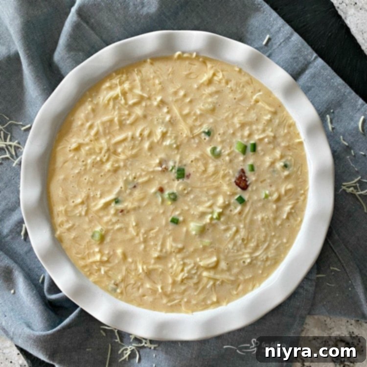 Mixing the wet ingredients and Bisquick for Impossible Pie with Bacon Swiss