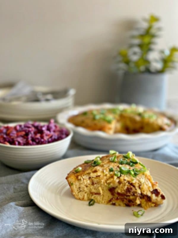 A slice of Impossible Pie with Bacon & Swiss, showing the layers