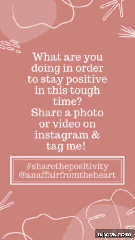 Woman holding a glass of wine, smiling and enjoying a moment of relaxation