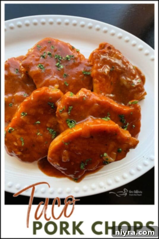 A serving of Taco Pork Chops, succulent and tender, with the rich red sauce.