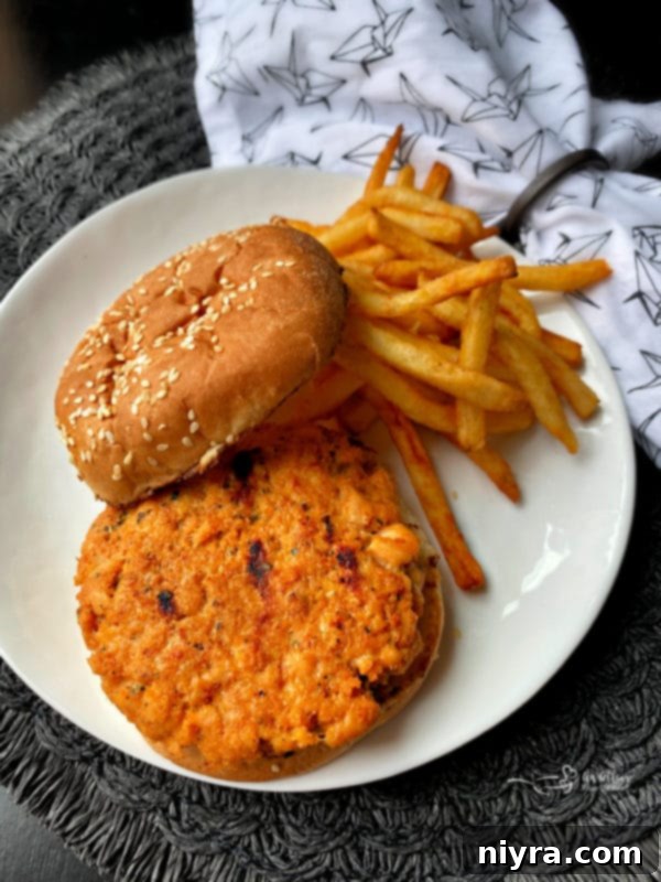 Blackened Salmon Burgers and BLT Slaw 6 Grilled salmon burger on a plate with the BLT slaw on the side
