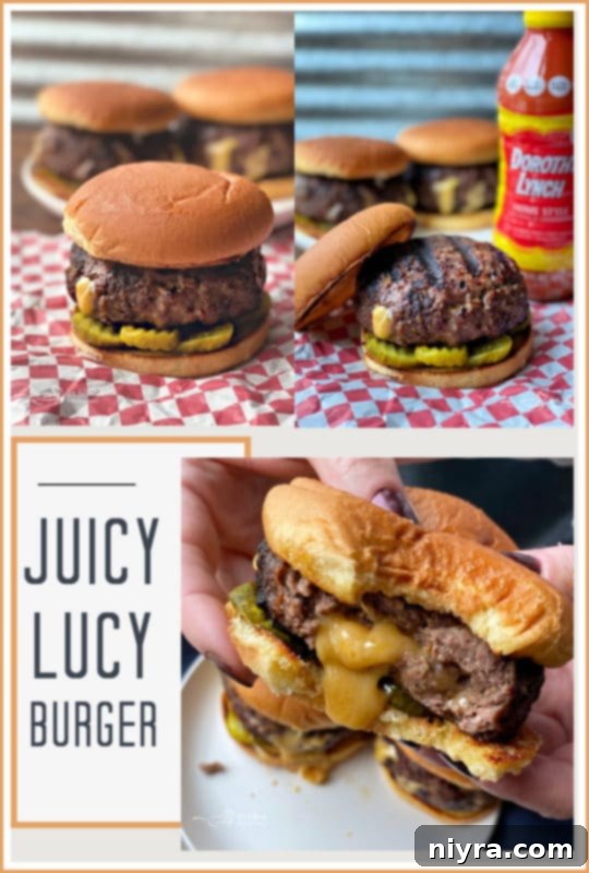 A Juicy Lucy burger on a plate, cut in half to show the melted cheese inside, with dill pickles.