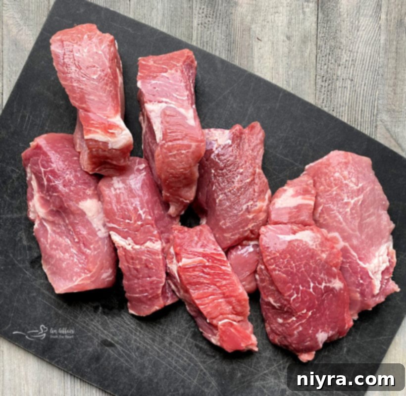 Uncooked country style pork ribs, ready for seasoning and preparation.