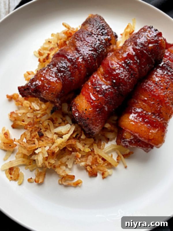 Sweet and spicy bacon-wrapped pork ribs served with hash browns, sweet corn, and cornbread.