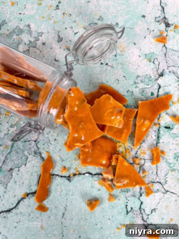 Peanut brittle cooling on a marble surface