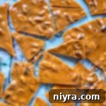 peanut brittle cracked on a marble surface