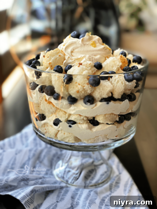 Bright Lemon Blueberry Trifle 5 Artful layering of a Lemon Blueberry Trifle showcasing cake, cream, and fruit
