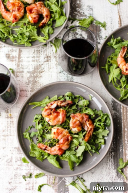 Plump bacon-wrapped shrimp, cooked to perfection and beautifully presented.