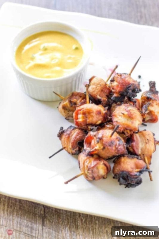 Bacon-wrapped hot dog bites, glistening and ready to serve.
