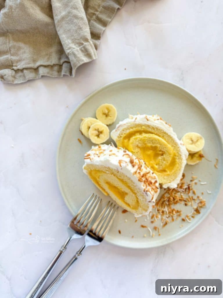 Slice of Banana Cream Jelly Roll Cake with toasted coconut