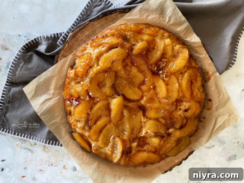 Caramel Apple Flip Cake 2 Golden brown Apple Upside Down Cake in a cast iron skillet, ready to be flipped