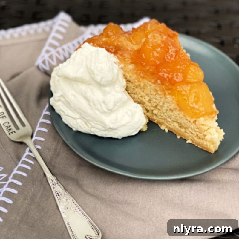 Caramel Apple Flip Cake 3 Close-up slice of Apple Upside Down Cake, showing the moist cake and caramelized apple topping