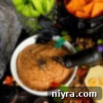 Spooky Sweet and Savory Halloween Snack Board with Peanut Butter Dip 8 close up of peanut butter dip