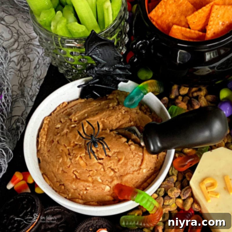 Spooky Sweet and Savory Halloween Snack Board with Peanut Butter Dip 7 Another close-up of the peanut butter dip, highlighting its creamy texture and serving suggestions.