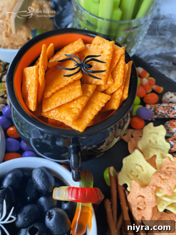Spooky Sweet and Savory Halloween Snack Board with Peanut Butter Dip 10 A close-up of the Halloween snack board, highlighting the various elements and decorations.