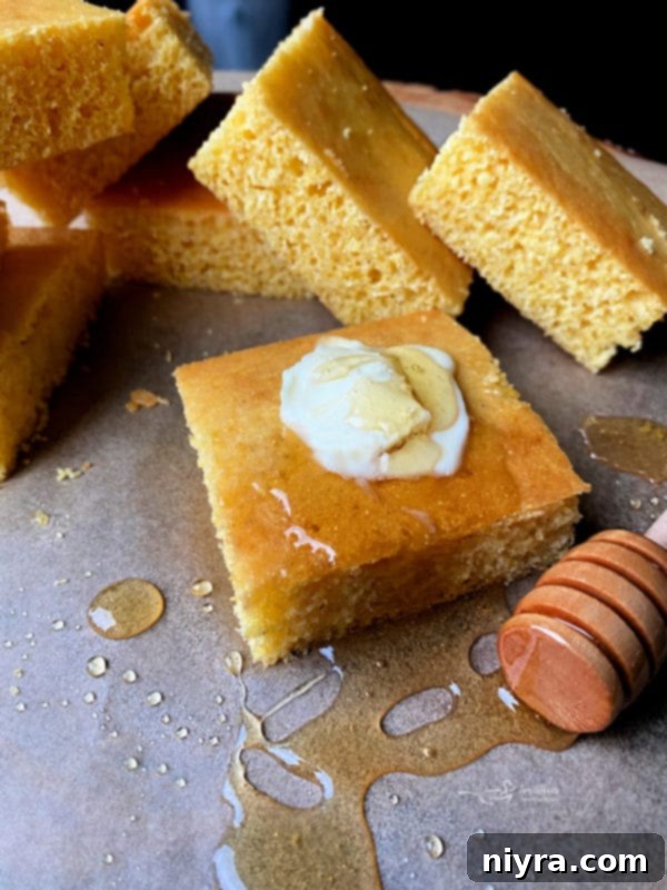 Golden brown honey cornbread in a baking dish