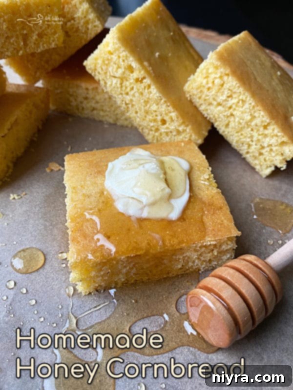 Two slices of honey cornbread on a plate