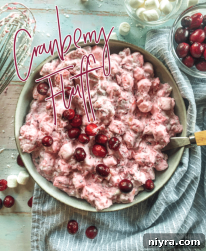 Cranberry Fluff, a festive dessert salad, in a serving bowl.