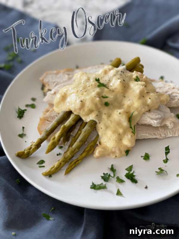 Another beautiful angle of the Turkey Oscar dish, emphasizing its elegance, the layers of ingredients, and its inviting, gourmet presentation, ready to be enjoyed.