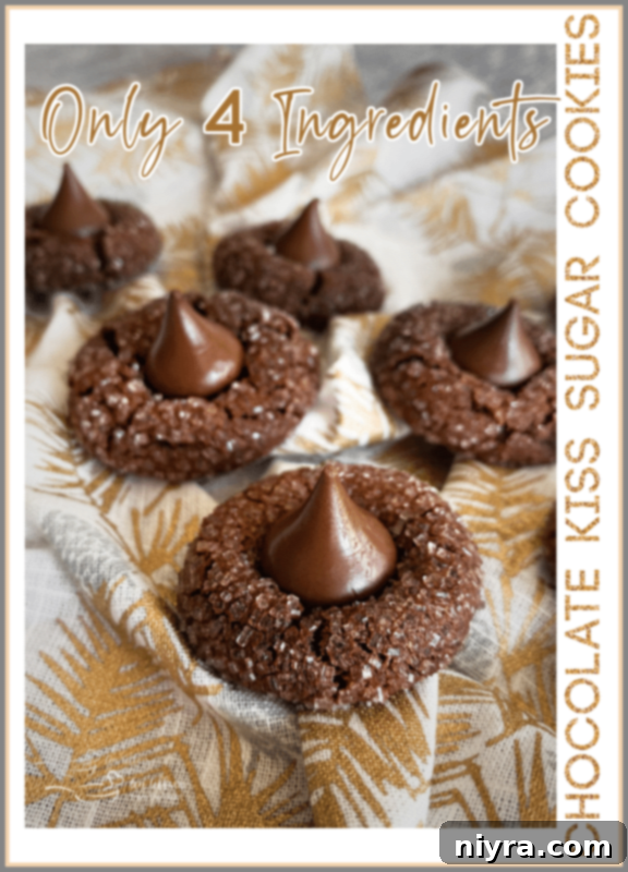 A stack of three Chocolate Sugar Kiss Cookies with a gold background, emphasizing their rich chocolate color and sparkly sugar coating, with a delicious chocolate kiss on top.