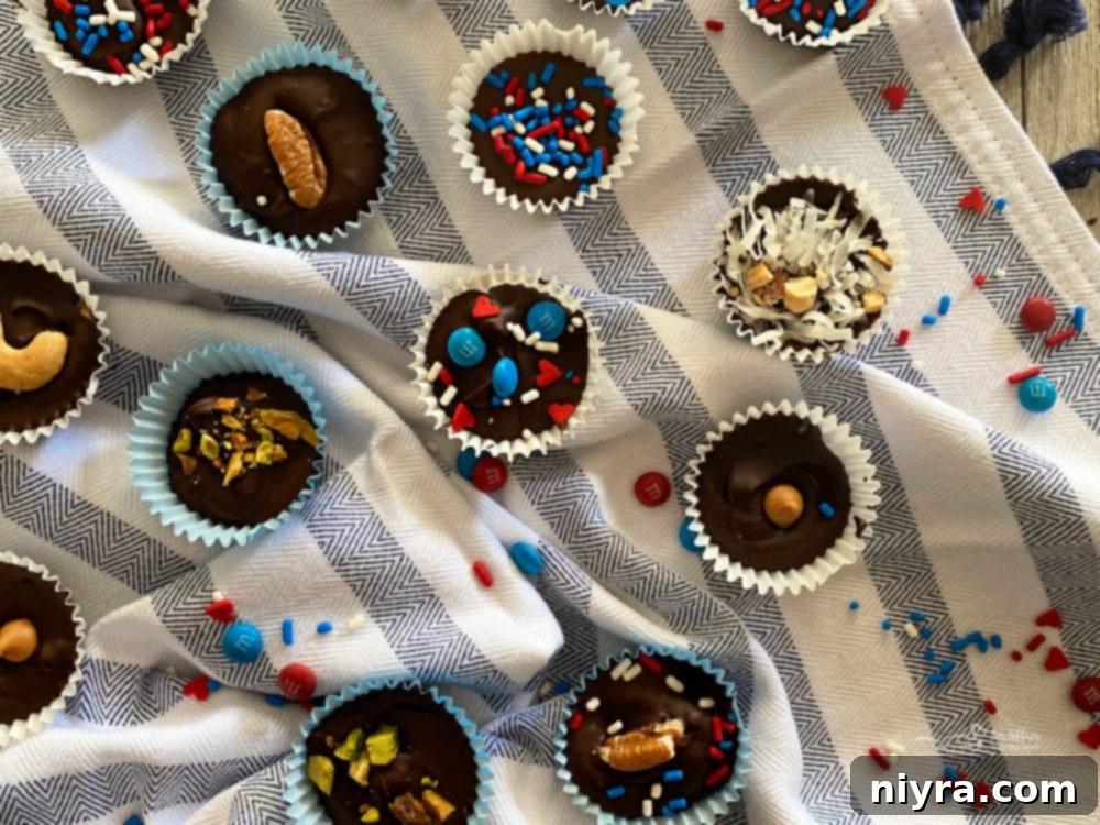 A trio of patriotic chocolate candy cups on a white surface