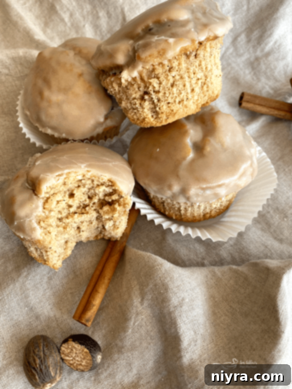 Glistening Spice Muffins 3 Close-up of golden Spiced Glazed Muffins with a glossy glaze, perfectly baked and ready to be served