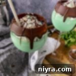 Emerald Dream 18 Side view of 2 grasshopper cocktails with a grey background