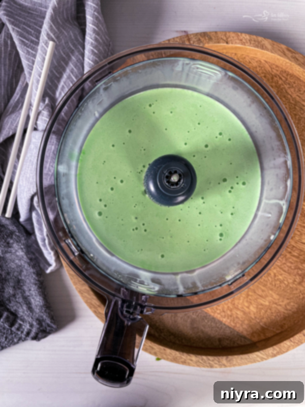 Emerald Dream 7 Blender with Grasshopper Cocktail ingredients actively blending.