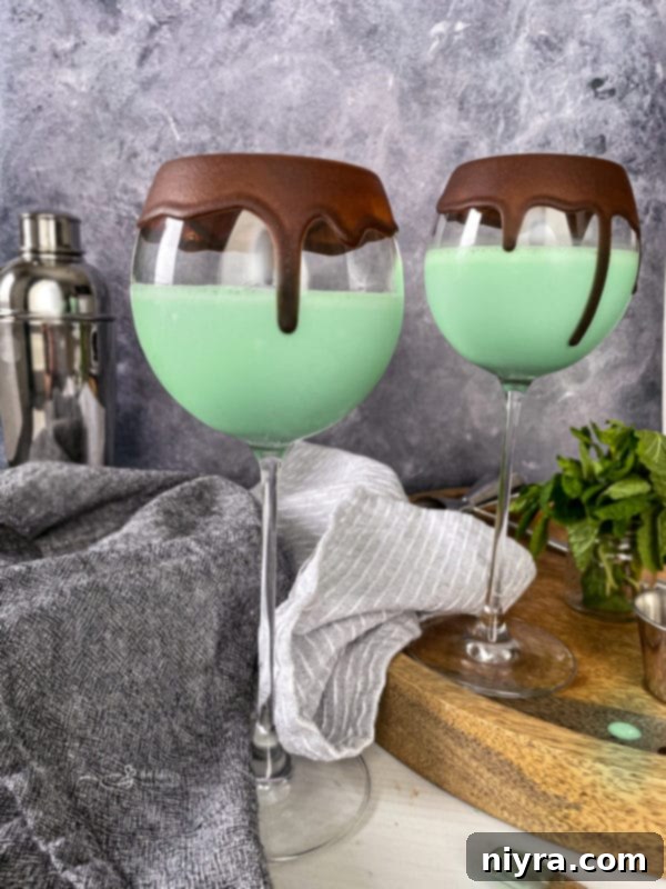 Emerald Dream 10 An elegant glass rimmed with melted chocolate, ready for a cocktail.