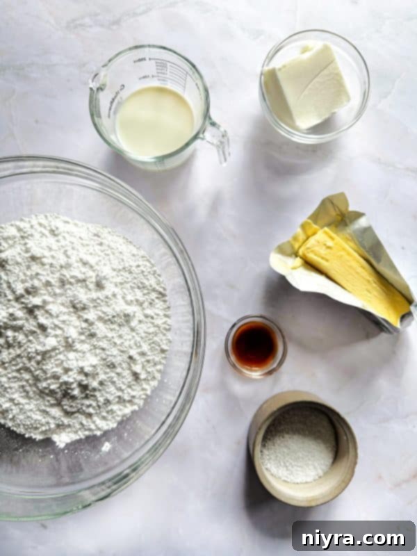 Ingredients for sugar cookie bars laid out on a table.