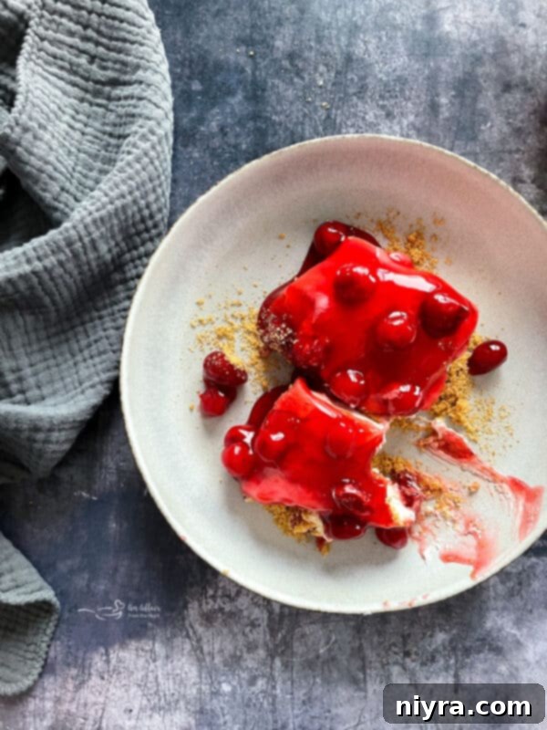 Crimson Cherry Indulgence 14 A Pinterest-friendly image showing a slice of cherry dessert on a plate with text overlay 'Cherry Dessert'.