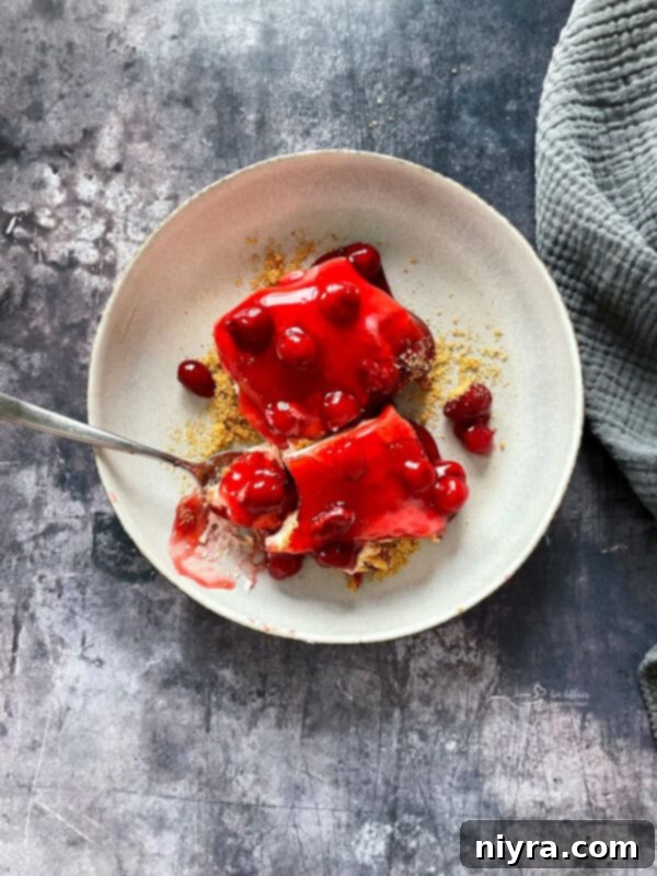 Crimson Cherry Indulgence 15 A close-up shot of the cherry pie filling topping on the dessert.