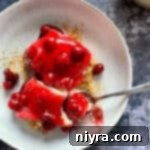 Crimson Cherry Indulgence 20 Close up of cherry desert on a fork.