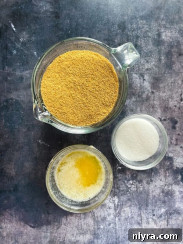 Crimson Cherry Indulgence 5 Ingredients for a No-Bake Cherry Dessert laid out: graham cracker crumbs, butter, sugar, condensed milk, lemon juice, Cool Whip, and cherry pie filling.