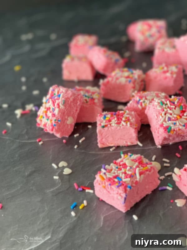Close-up of Pink Valentine Fudge with sprinkles, ready to be enjoyed