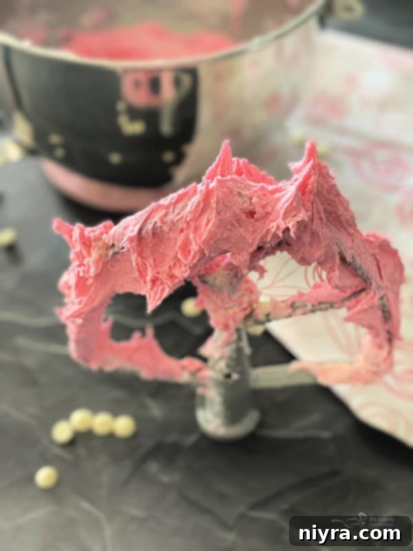 Artfully stacked pink fudge pieces with a sprinkle of colorful hearts