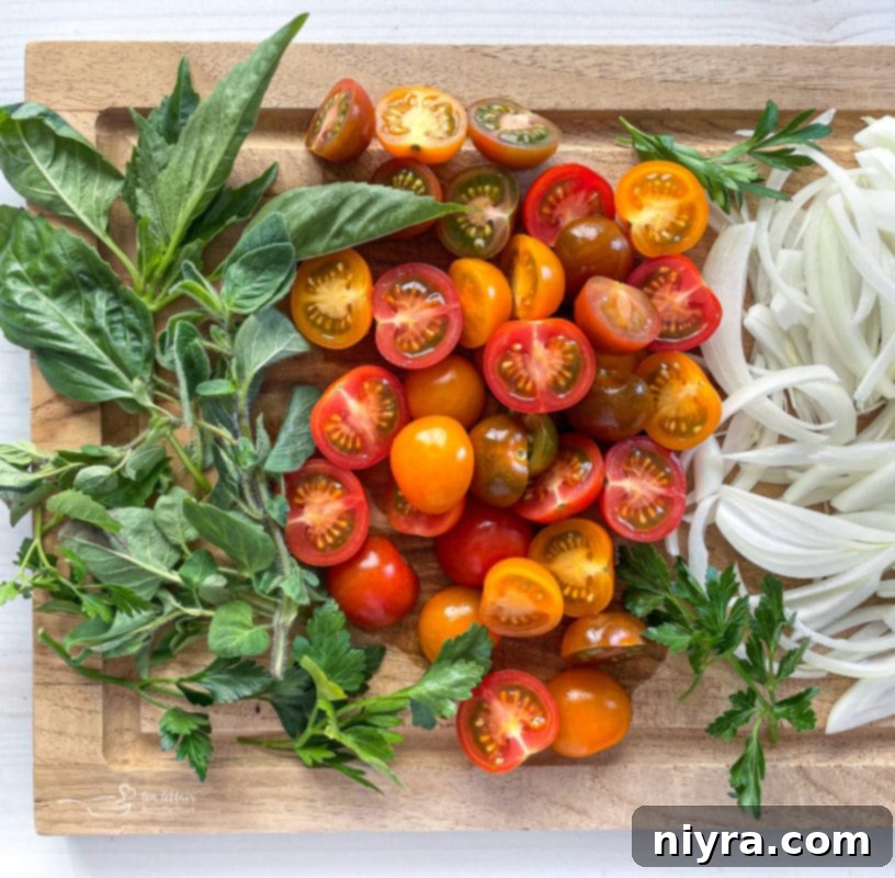 Italian Deli Pasta Salad 4 basil, tomatoes, and onions on wooden cutting board